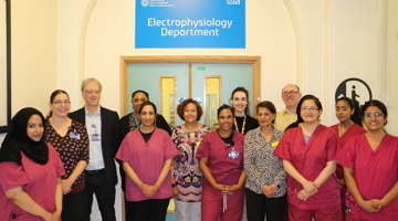 Electrophysiology team, men and women, standing in Moorfields hospital.