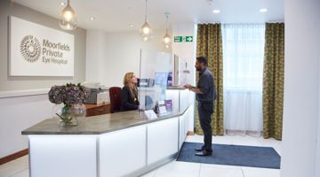 A patient arrives at Moorfields Private reception