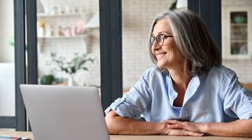 Woman at home with computer