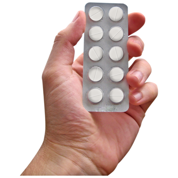 Hand holding blister packaging containing white tablets