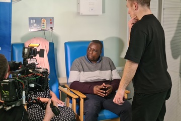 Ted Taziveyi, cataract patient at Moorfields, being interviewed by Dr Nighat Arif for ITV's This Morning