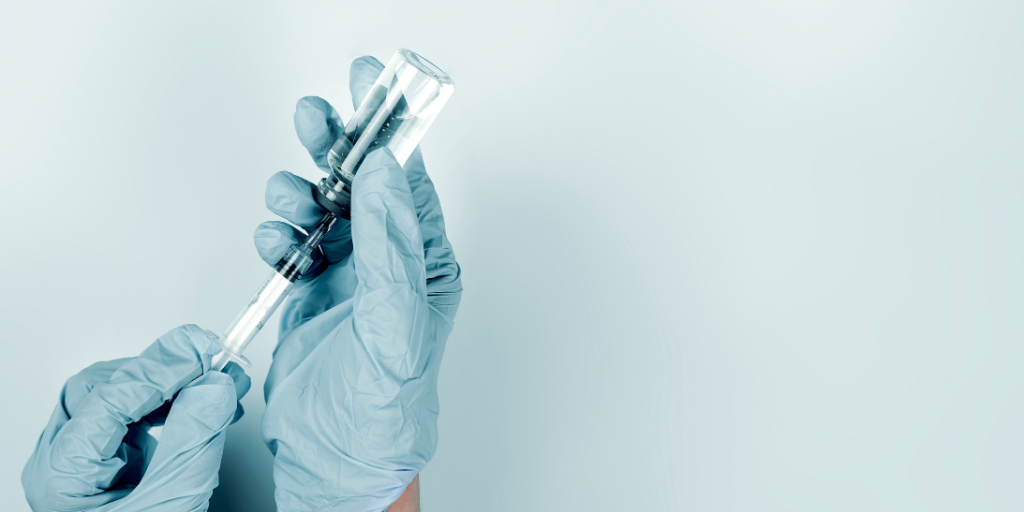 close up medical person with injection needle