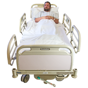 Person lying in a hospital bed