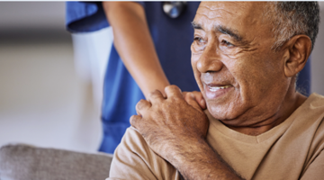 Patient holding the hand of a medical professional