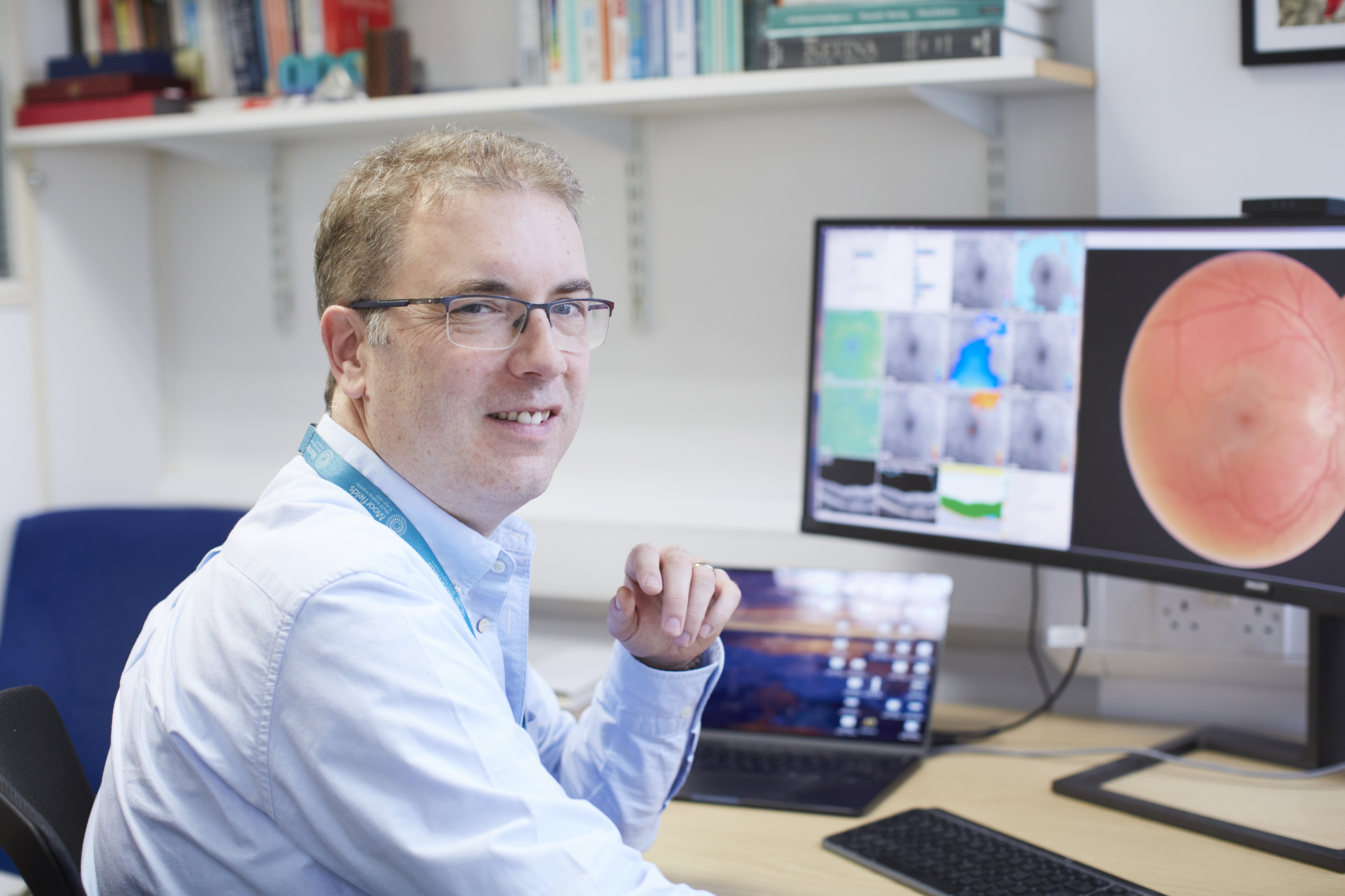 Pearse Keane working on his computer