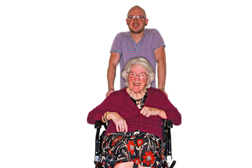 Person in a wheelchair being pushed by their carer