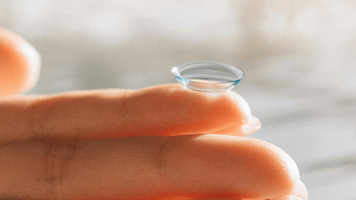 Contact lens on fingertips