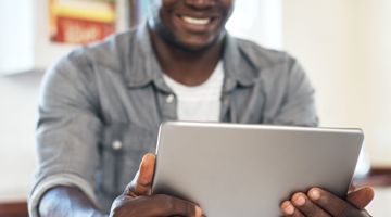 A man looking at the ipad