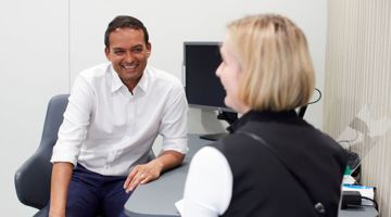 Jaheed Khan in consultation with a patient